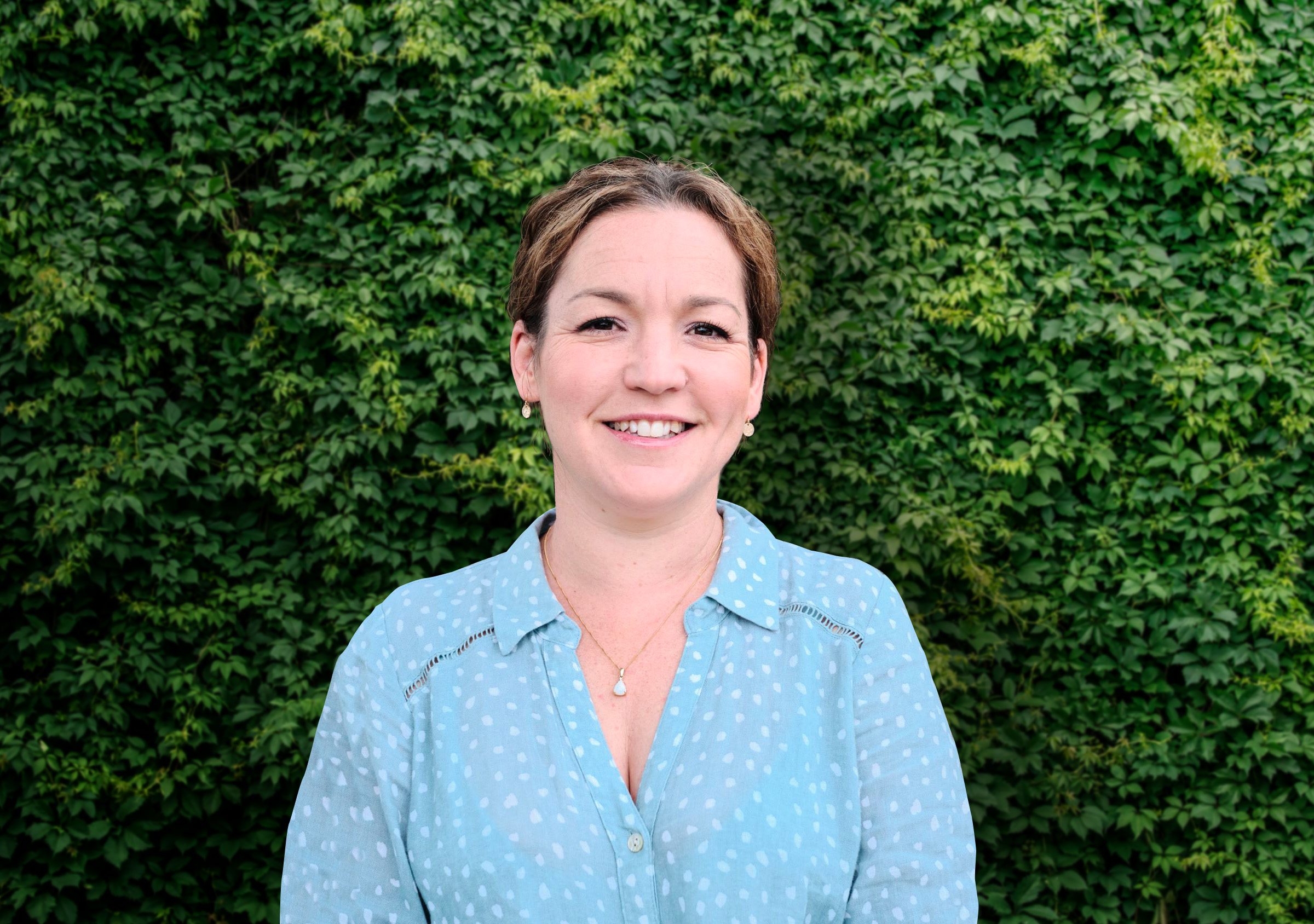 a women smiling looking at the camera