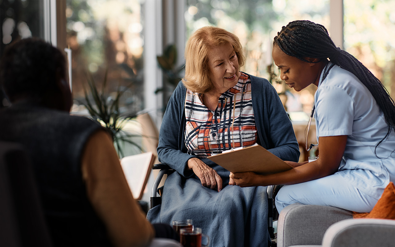 Healthcare worker discussing with patient
