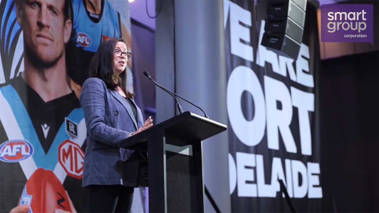 a professional business women giving a speech