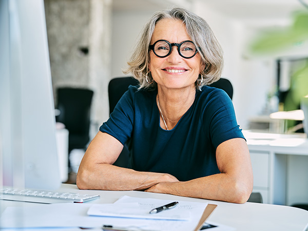 women in glasses smiling at the camera